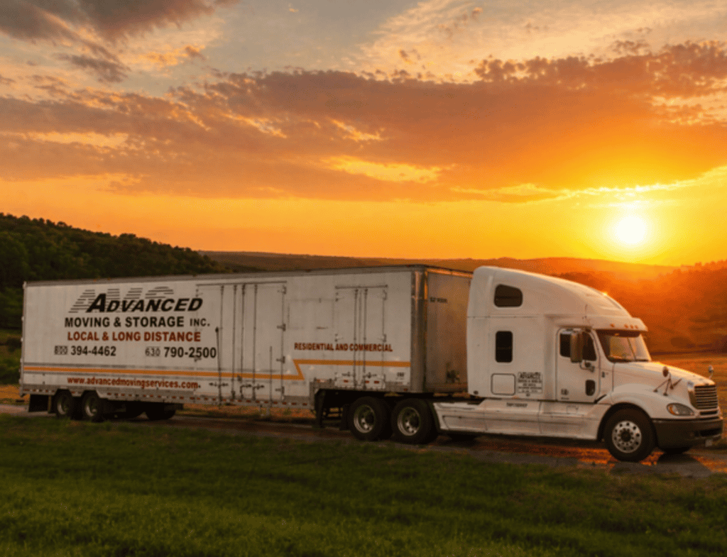 advanced moving & storage truck at sunset